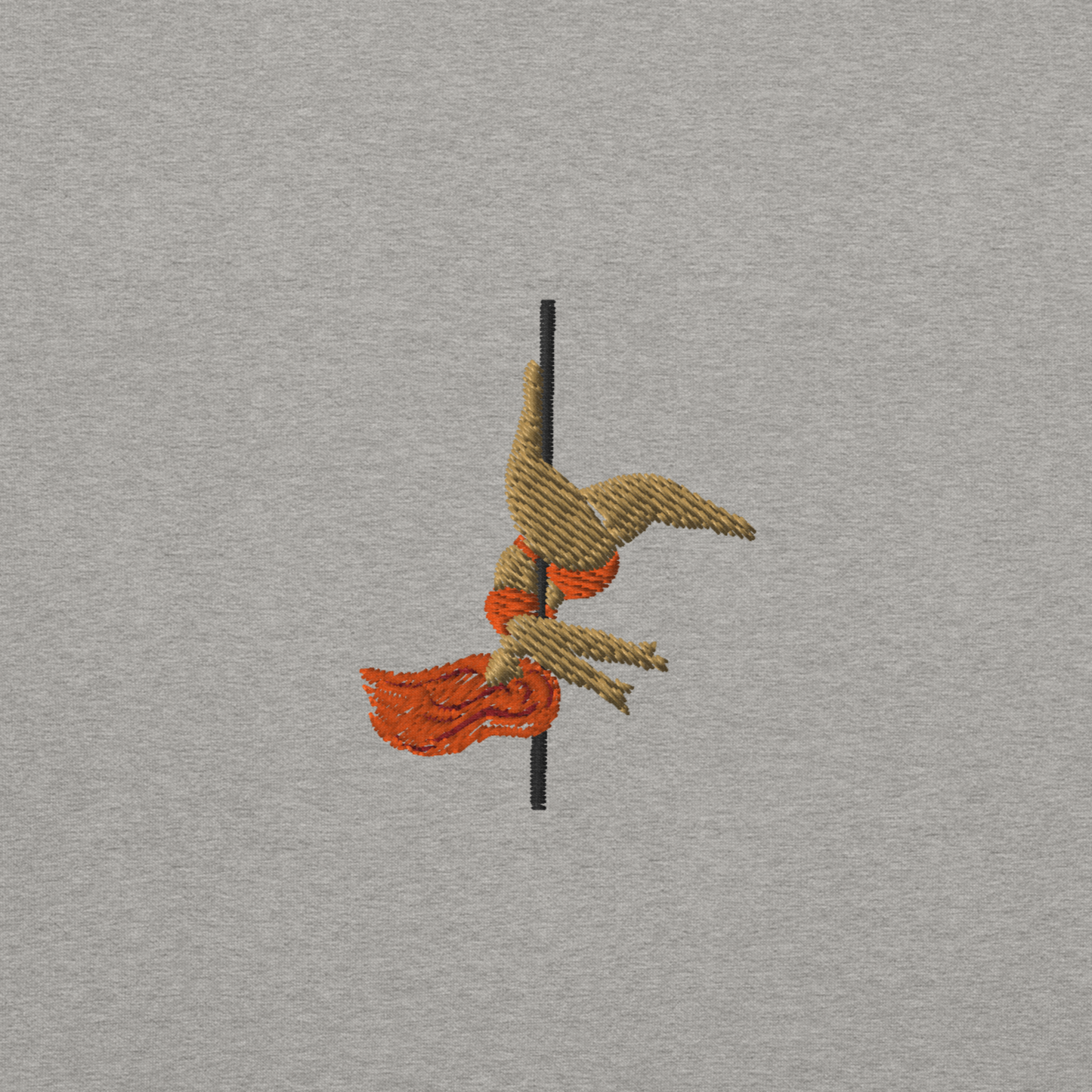 Close up of an embroidery of a pole dancer doing an inversion