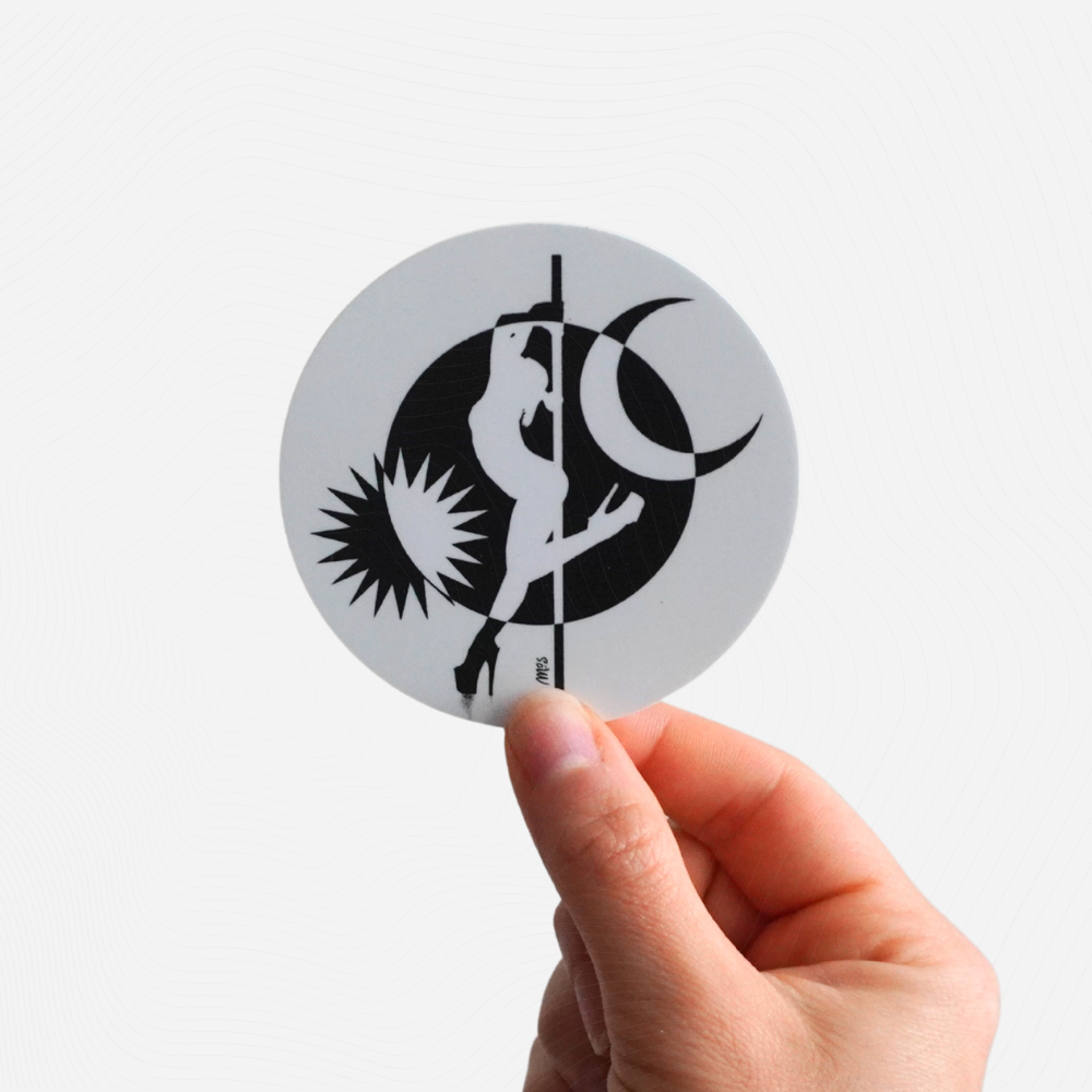 Circular sticker with black and white design of a pole dancer held by a hand against a white background