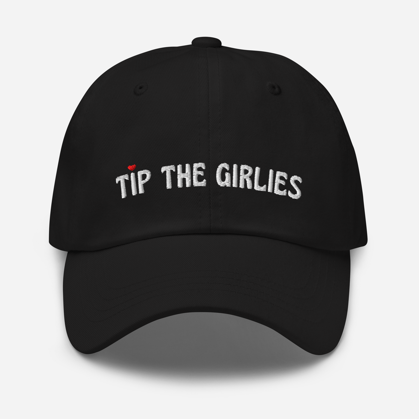 Black cap with the words "Tip the Girlies" embroidered in white letters across the front. The first "I" is topped with a red heart.