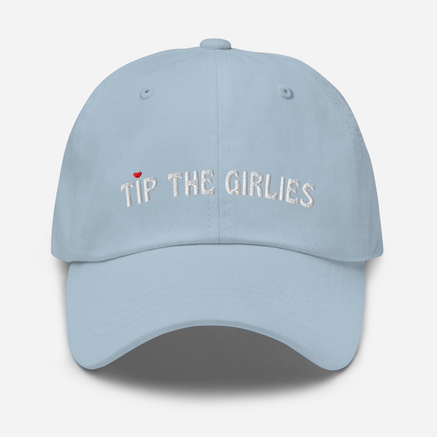 Light blue cap with the words "Tip the Girlies" embroidered in white letters across the front. The first "I" is topped with a red heart.