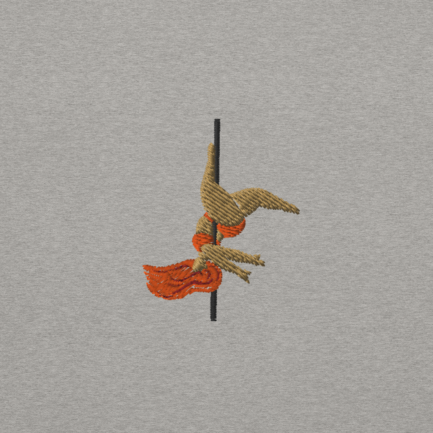 Close up of an embroidery of a pole dancer doing an inversion